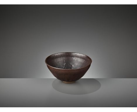 A RARE JIAN ‘HARE’S FUR’ BOWL WITH FLORAL DECORATION, JIN DYNASTYChina, 1115-1234. The rounded sides rising from a short ring