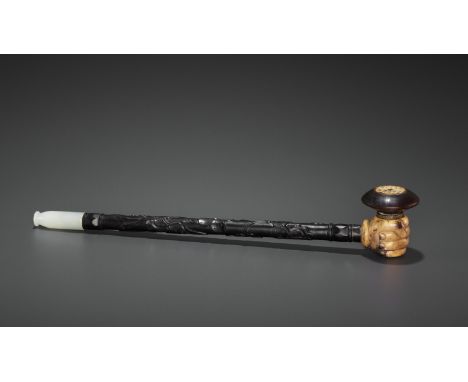 A HARDWOOD OPIUM PIPE WITH JADEITE, IVORY AND ZITAN FITTINGS, LATE QING TO REPUBLICChina, late 19th to early 20th century. Th