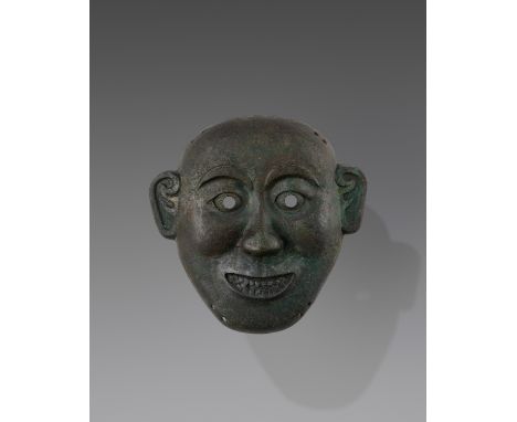 A BRONZE DEATH MASK, SONG TO MING DYNASTYChina, 960-1644. Cast as the face of a man, with arched eyebrows above round pierced