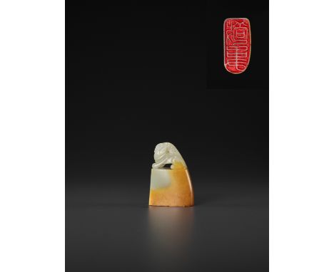 A PALE CELADON AND AMBER JADE ‘BUDDHIST LION’ SEAL, MID-QING TO REPUBLICChina, late 18th to early 20th century. Of rounded-re