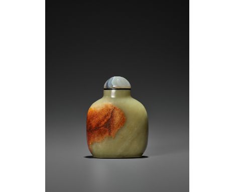 A LARGE YELLOW AND RUSSET JADE SNUFF BOTTLE, QING DYNASTYChina, 18th century. Extremely well hollowed through a minuscule mou