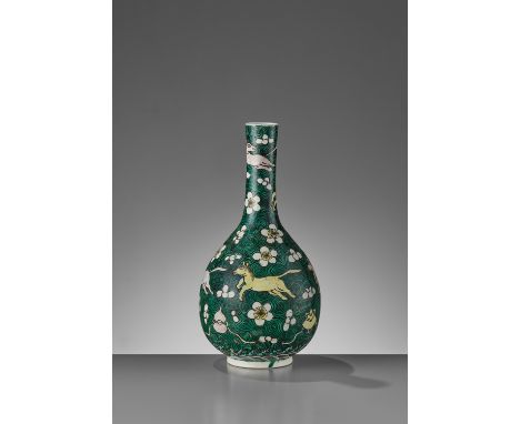 A FAMILLE VERTE ‘HORSES AND SWIRLS’ BOTTLE VASE, KANGXIChina, 1661-1722. The globular porcelain body rising from a slightly s