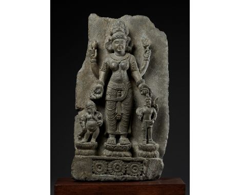 AN IMPORTANT STONE STELE OF PARVATI WITH HER SONS GANESHA AND SKANDALate Kushan Empire, 4th-5th century. The finely carved re