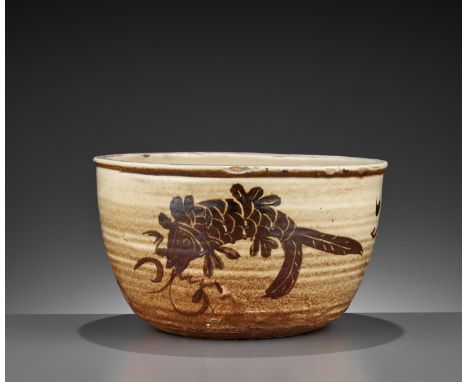A PAINTED CIZHOU ‘DOUBLE FISH’ BASIN, SONG-YUANChina, 960-1368. The gently grooved and rounded sides rising from the circular