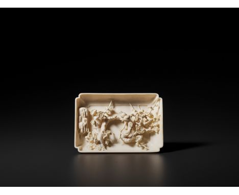 A CARVED IVORY BASE WITH A HIDDEN ‘BIRDS AND PRUNUS’ SCENE, QINGChina, 1644-1912. Of rectangular form with rounded sides and 