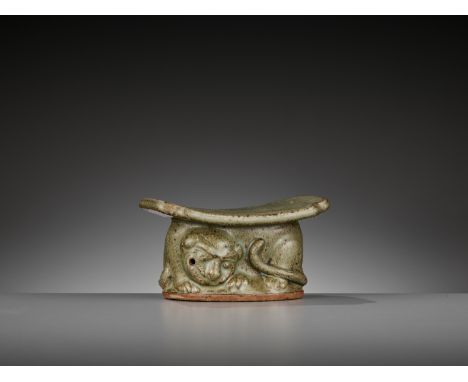 A YAOZHOU CELADON ‘TIGER’ PILLOW OR WRIST REST WITH OFFICIAL MARK, LATE TANG TO EARLY SONGChina, 9th-11th century. The base m