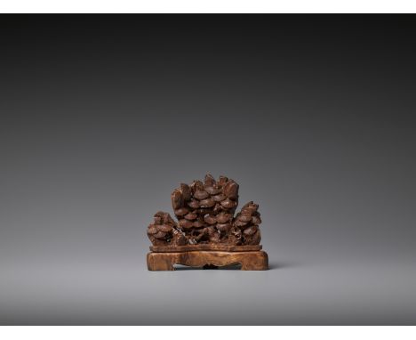 A CARVED BAMBOO PINE-FORM BRUSH REST, QING DYNASTY, 18TH CENTURYThe gently formed brush rest is naturalistically carved as pi