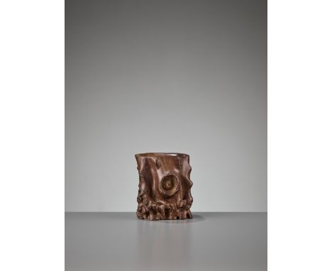 A CARVED HUANGHUALI ‘IMITATION BURLWOOD’ BRUSH POT, BITONG, 17TH CENTURYChina, 17th century. The rather heavy vessel is natur