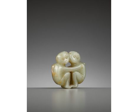 A CELADON JADE ‘TWO MONKEYS’ PENDANT, QING DYNASTYChina, 1644-1912. Carved as two side-facing monkeys standing cheek-to-cheek