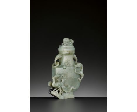 A CELADON AND GREY JADE BALUSTER VASE AND COVER, QING DYNASTYChina, 18th century. The flattened shield-shaped body carved in 