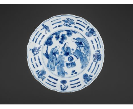 A BLUE AND WHITE ‘BAGUA’ LOBED DISH, KANGXI PERIODChina, 1662-1722. The shallow lobed sides rising from the short ring foot t