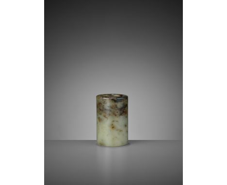 A MOTTLED CELADON JADE BRUSH POT, BITONG, QING DYNASTYChina, 19th century or earlier. Of cylindrical form with thick sides, t