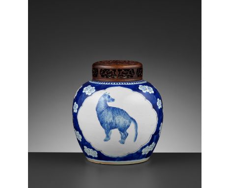 A BLUE AND WHITE ‘DOG AND DEER’ GINGER JAR, KANGXIKangxi period, 1662-1722.&nbsp;Painted with two multilobed medallions enclo