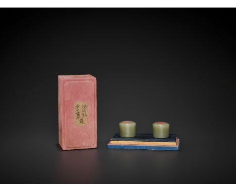 A PAIR OF CELADON JADE ARCHER’S RINGS, QING DYNASTYChina, 1644-1912. The rings of cylindrical form and undecorated, the trans