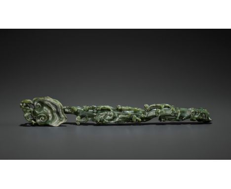 A SPINACH-GREEN JADE RUYI SCEPTER, MID-QINGChina, 18th century. Carved in the form of a lingzhi fungus, with a bat perched on