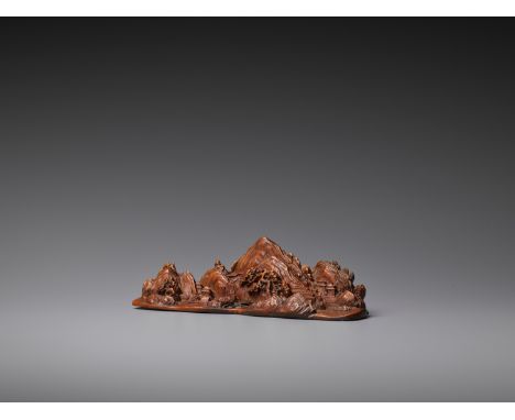 A CARVED BOXWOOD ‘MOUNTAIN LANDSCAPE’ BRUSH REST, LATE QING TO REPUBLICChina, 1820-1940. Carved as a mountainous landscape wi