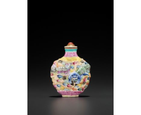 A FAMILLE ROSE MOLDED PORCELAIN ‘BUDDHIST LIONS’ SNUFF BOTTLE AND MATCHING STOPPERChina, 18th-19th century. Molded and painte