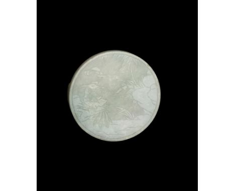 A PALE CELADON JADE BELT PLAQUE, QING DYNASTY OR EARLIERChina, 1644-1912 or earlier. Of circular form, finely incised to the 