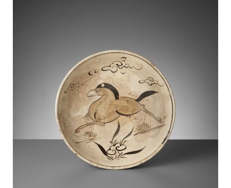 A PAINTED CIZHOU ‘GALLOPING HORSE’ DISH, MINGChina, 1368-1644. The shallow rounded sides rising from a short ring foot to an 