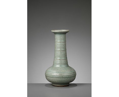 A GUAN-TYPE CRACKLED ‘BAMBOO NECK’ BOTTLE VASE, LATE MING TO EARLY QINGChina, 17th-18th century. The compressed globular body