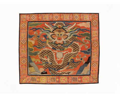 A KESI RED-GROUND DRAGON PANEL, QINGChina, 17th-18th century. Embroidered with a large front-facing four-clawed mang dragon w
