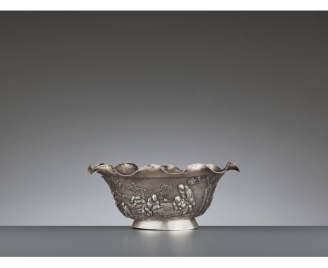 A SILVER REPOUSSE ‘WEIQI PLAYERS’ BOWL BY KWONG MAN SHINGChina, Canton or Hong Kong, c. 1900. The deep rounded sides rising f