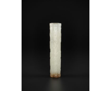 A WHITE JADE BRUSH COVER, QING DYNASTYChina, 1644-1912. Of cylindrical form, carved in relief with round fruit finely incised