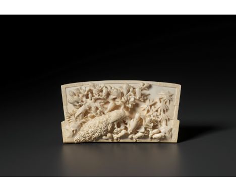 A RETICULATED IVORY ‘PEACOCK’ TABLE SCREEN PLAQUE, QINGChina, 19th century. The fan-shaped plaque finely carved in openwork a