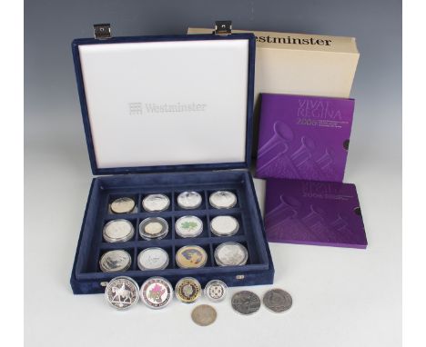 A small collection of British commemorative coins, including two Britannia silver two pounds coins, 1998 and 2000, and an Eli