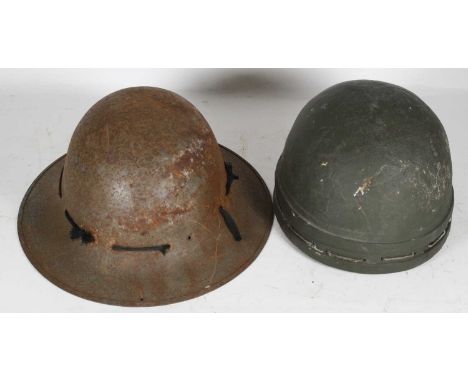 A WWII British Despatch Rider's helmet, of green painted fibre construction, the rim with twin ribs and cord fastening with l
