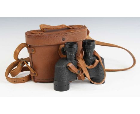 A pair of U.S. army 60 x 30 binoculars marked Wollensak Rochester U.S.A, in a fitted leather case.