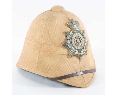 A Foreign Service cloth covered pith helmet, having a green cloth interior with brown leather band and chin strap, with helme
