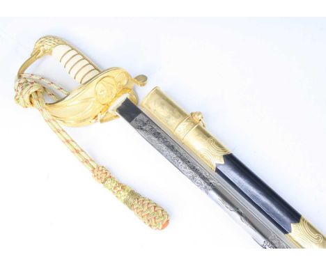 A Royal Air Force dress sword, the 80cm blade etched with an eagle in flight and foliage with Knights helmet logo WKC Solinge