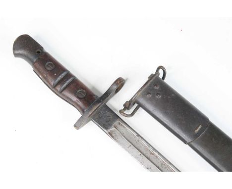 A 1913 pattern Remington bayonet, the 43cm single edged fullered blade stamped to the ricasso 1913, 9 17 Remington and US to 