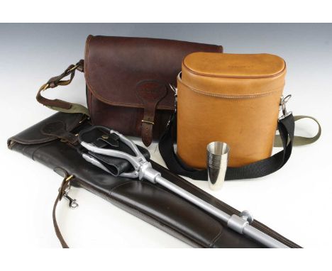 A good quality brown leather gun slip with fleece lined interior, together with a brown leather cartridge bag on canvas strap