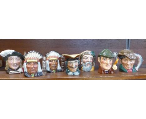 A collection of seven Royal Doulton medium character jugs including The Poacher decanter
