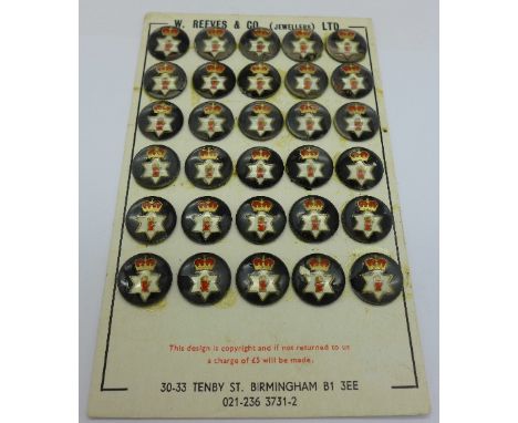 Thirty glass military button tops, mounted on retail card