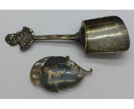 A silver caddy spoon, import, and a silver brooch, 28.6g