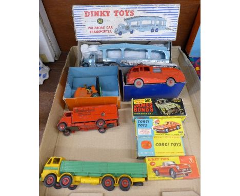 Four boxed Dinky Toys, 582 Pullmore Car Transporter, 555 Fire Engine, 14c Coventry Climax Fork Lift Truck and 114 Triumph Spi