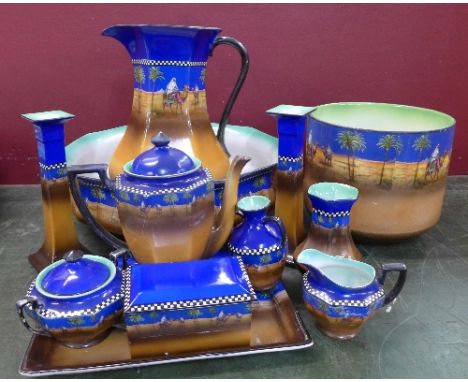 A H & K pottery bedroom set comprising wash jug & bowl, jardiniere, pair of candlesticks, teapot with sugar, cream, soap dish