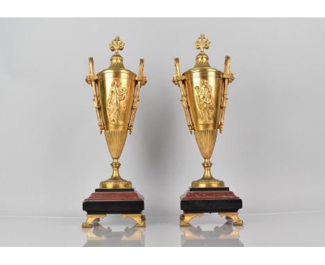 A Pair of French 19th Century Gilt Bronze Garnitures in the Form of Two Handled Lidded Vases having Classical Maiden Decorati