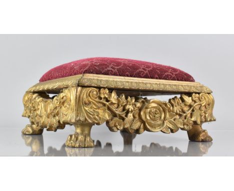 A 19th Century Carved and Pierced Gilt Stool of Square Form with tapestry Top having Floral Swag Sides, raised on Four Claw F