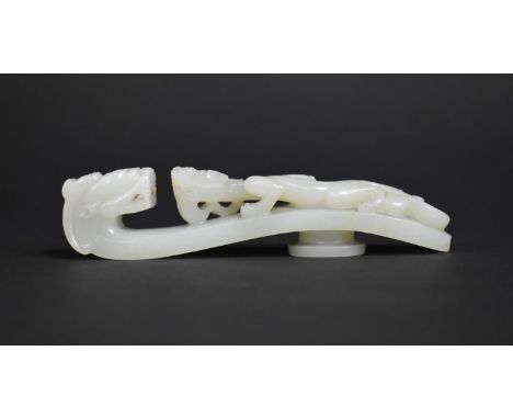 A Chinese White Jade Chi Dragon Belt Buckle, 13cms Wide 
