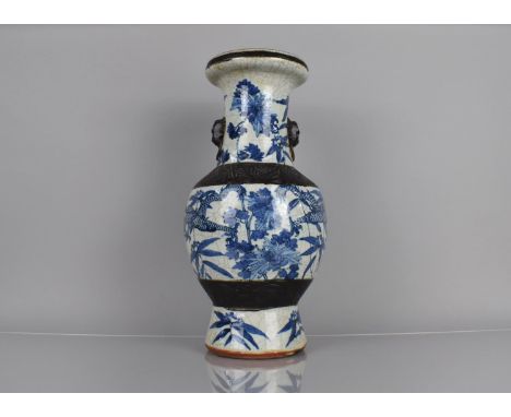 A 19th Century Blue and White Crackle Glazed Vase decorated with Dragons Amongst Foliage an Flowers, Oxidised Bands and Styli