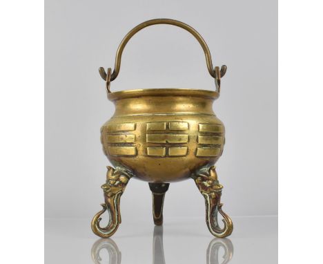 A Cast Bronze Tripod Cauldron Censer Incense Burner Raised on Scrolled Supports with Mask Head Design, Loop Handle, 23.5cms H