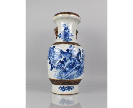 A Large Chinese Blue and White Crackle Glazed Vase Decorated with Birds in Blossoming Branches, Oxidised Trim and Stylised Ri