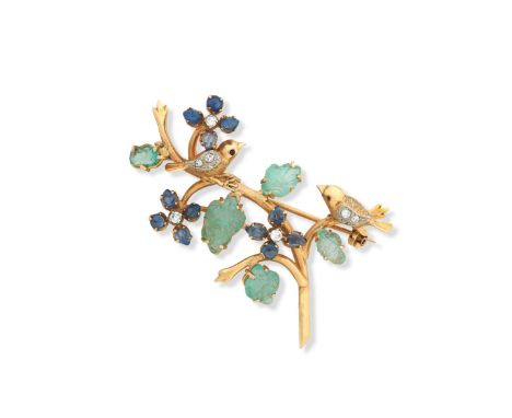 A sapphire, emerald and diamond broochDesigned as two birds, with ruby-set eyes, perched amid a floral and foliate twig, set 