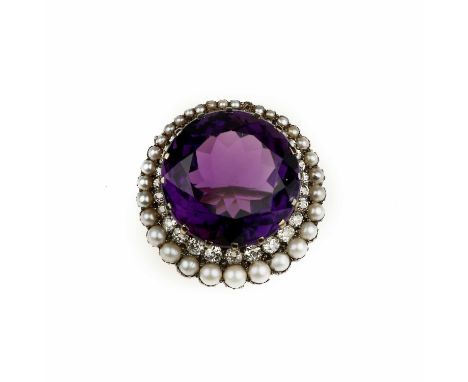 An amethyst and seed-pearl pendant/broochClaw-set with a circular-cut amethyst, measuring 22.8 x 22.8 x 14.0mm, framed by a d