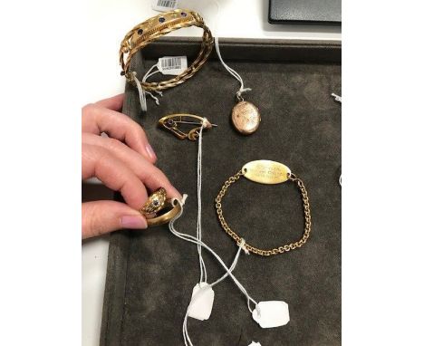 A collection of jewelleryComprising: a gem-set bangle, stamped '375' and maker's mark T&amp;G; a gem-set ring, stamped '375';