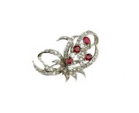 A ruby and diamond brooch, early 20th centuryOf foliate spray design, set with graduated round brilliant and single-cut diamo